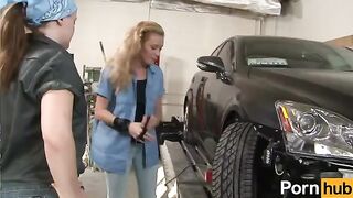 The pretty and sexy girl is working in the auto shop. She is helping a customer