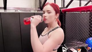 A redhead girl is having fun with her personal trainer after a workout