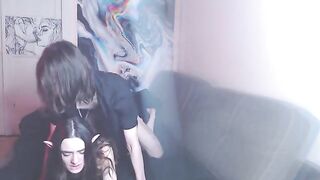 A couple enjoys intimate moments on their couch, creating a homemade video
