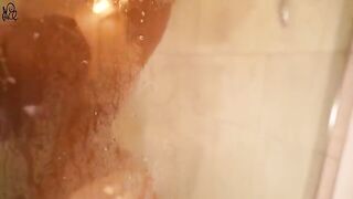 A young girl caresses her body with a cream, sliding on a huge toy