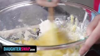 Two girls are busy with their stepdads’ dessert in the kitchen