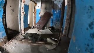 An exhibitionist girl is walking around horrible buildings with her sexy babe