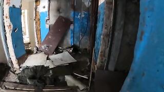 An exhibitionist girl is walking around horrible buildings with her sexy babe