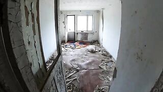 An exhibitionist girl is walking around horrible buildings with her sexy babe