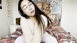 A young and charming Chinese girl is very happy to play with herself