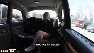 A cute model is being fucked in the back seat of a taxi