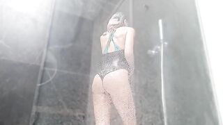 Masturbates to squirting orgasm in shower