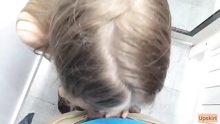 The petite girl was nearly caught while sucking cock in the changing room