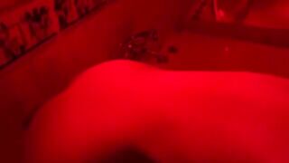 A blonde is playing with toys in the bathroom and gets excited