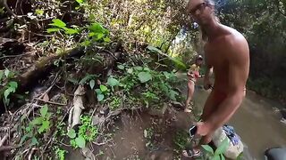 A couple is fucking on the riverbank in the jungle