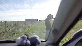 A girl is having fun with her boyfriend on a road trip, getting wild