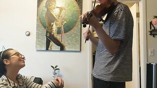 The couple was trying to practice violin but couldn’t