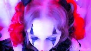 The face of the clown is covered with sperm after sex