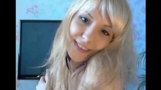The beautiful blonde caresses her pussy with her fingers