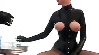 Lesbians in latex rub their bodies and get excited