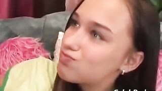 A cute girl has sex with an adult guy on the couch