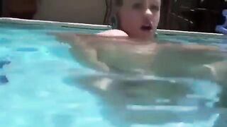 Babe playing with dildo in her ass while swimming in the pool