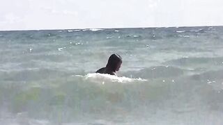 Two hot chicks are getting a tan on the naked beach