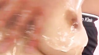 Hot Japanese chick rubs her boobies with oil and fingering her pussy