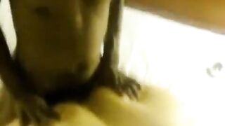 A fat woman laid on two guys and let them have their way with her