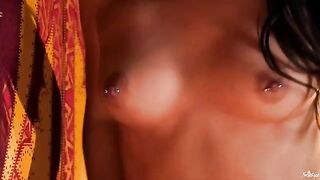 A girl with a clitoris piercing plays with her nipples and fingers