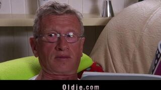 A hot blonde woman is getting fucked by an older man on the couch