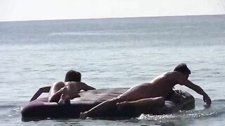 Nude beauties have sex on the beautiful beach