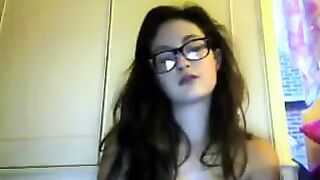 A cute student with glasses gets undressed on webcam