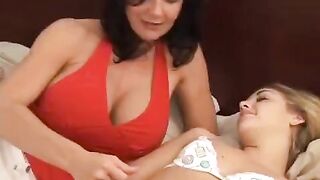 Lesbian beauties with different ages fuck using a strapon dildo