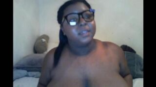 Black woman closed the camera while milking her big tits