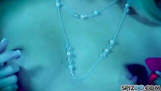 A blonde girl caresses herself with a dildo in her pussy