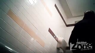 The camera is secretly filming in the woman's toilet. Don't peek!