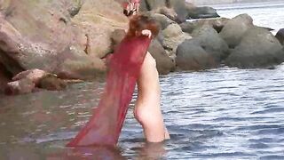 A girl with small boobs got them wet in the rain