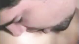 A guy has sex with a strapon and another girl plays with his dick