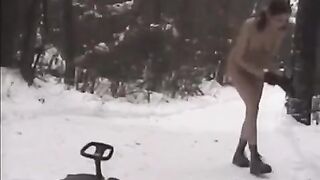 Nude girls have fun with snowballs on the street