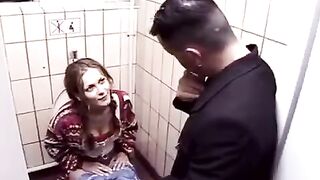 A guy fucked brunette in the toilet, imitating a hardcore night club scene