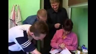 A Russian mom is having fun with four young guys at once