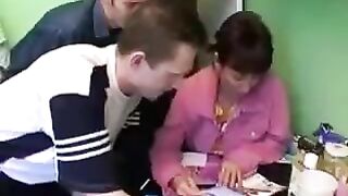 A Russian mom is having fun with four young guys at once