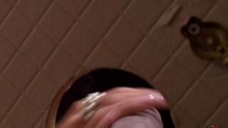 A charming woman made a blowjob right in the toilet hole