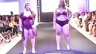 Some fat women are running on the boardwalk and playing with their bodies in swimsuits