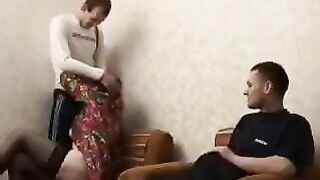 A mature woman fucks her son and his friend in this hot video