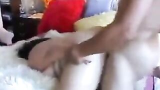 A thick ass Asian girl is riding on the dick of a man