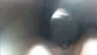 A black girl caresses herself, moaning, and showing her wet pussy