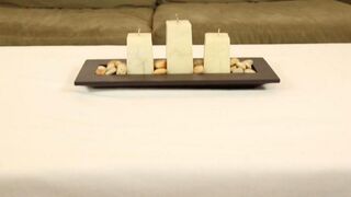 The masseur is jerking his client under the table during the massage