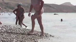 A sexy girl is walking naked on the coast of Crimea