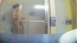 A girl has a shower, not knowing there’s a hidden camera