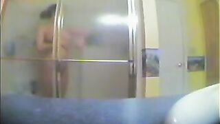 A girl has a shower, not knowing there’s a hidden camera