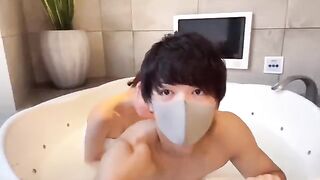 Japanese guy has a powerful ejaculation with lotion play, showcasing his unique style
