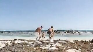 Blonde beauty gets fucked by two guys on the sandy beach in hardcore eporn action