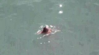 A pair of passionate lovers are not ashamed to show their bodies in the middle of the sea